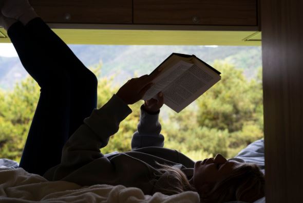 Camper reading a book